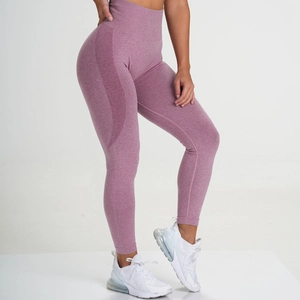 Seamless high waisted yoga pants in dusty rose featuring peach lift knitted contours