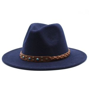 Detail of navy fedora hat featuring woven leather band with turquoise beads and studs