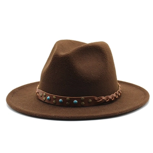 Detailed close-up of brown wool fedora hat with turquoise beads and metallic studs belt