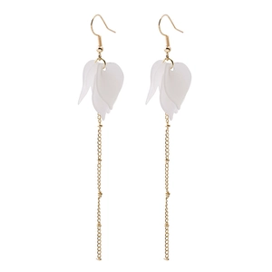 Detail view of long tassel earrings featuring white frosted flower petals and gold chains