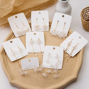 Elegant 925 silver needle daisy earrings collection with frosted white petals on gold metal