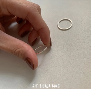 Close-up of dual minimalist 925 sterling silver square line rings for stacked wearing