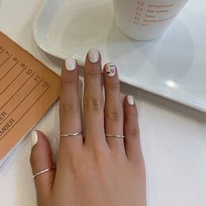 Three-piece set of 925 sterling silver minimalist rings featuring wave and smooth textures