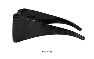 Detail view of bold black sunglasses with unique textured horizontal stripe temples