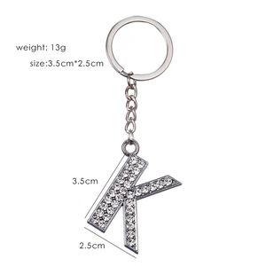 Silver letter K keychain with white rhinestones showing dimensions 3.5cm x 2.5cm and 13g weight