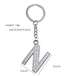 Detailed view of silver letter N keychain with sparkling rhinestones and dimensions