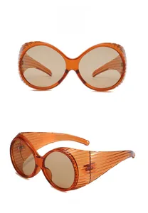 Detail view of tea-colored fashion sunglasses with unique horizontal ribbed frame texture