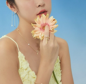 Elegant Chinese style open ring with tassels and matching jewelry on a model