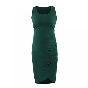 Detail of ruched side seams and slim fit design on dark green maternity bodycon dress