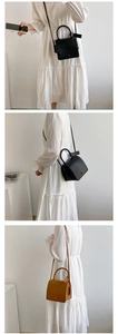 Vertical collage of minimalist leather crossbody bags in black and brown on a model