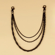 Close-up of triple-layered matte black trousers chain with durable lobster clasps