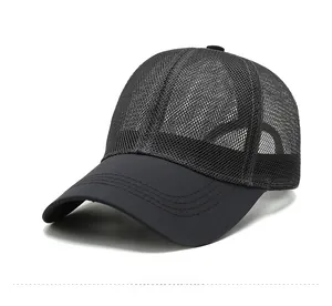 Close-up of black breathable mesh fabric and reinforced brim stitching on baseball cap