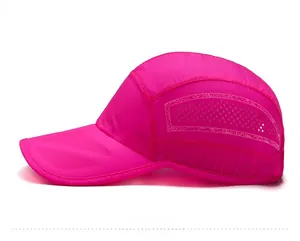 Detail of rose pink quick-dry sports cap with laser-cut side vents and white logo
