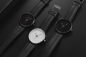 Detailed close-up of three YOLAKO quartz watches with leather straps and small sub-dials