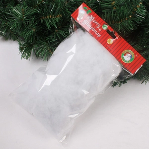 Artificial white cotton snow for Christmas tree decoration in festive holiday packaging