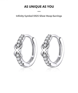 Detailed macro view of S925 sterling silver infinity symbol earrings with cubic zirconia stones