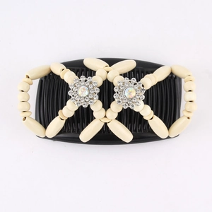 Detail of beaded magic hair comb with wooden beads and sparkling rhinestone flower accents