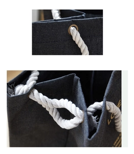 Close-up of denim tote bag with cotton rope handles, metal eyelets and LOVE print