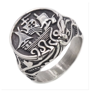 Vintage stainless steel signet ring with embossed sailing ship and nautical waves design