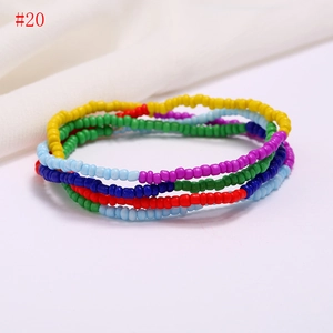 Macro shot of colorful layered bead waist chains for women with summer beach style