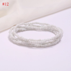 Detail of multi-strand white seed bead bracelet featuring elegant handmade craftsmanship