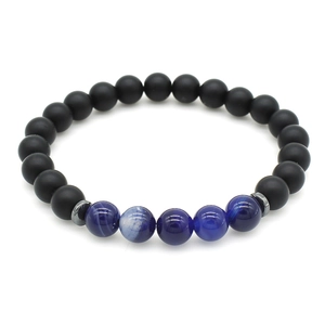 Close-up of beaded bracelet with black frosted beads, blue striped agate, and silver spacers