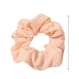 Detailed size chart of orange gingham hair scrunchie with 10cm diameter measurement