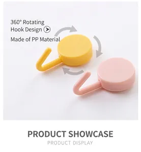 Detail showing two colored PP material 360-degree rotating 3-prong wall hooks in pink and yellow
