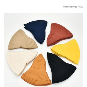 Flat lay of foldable wide-brim sun hats in 7 colors with reinforced stitching