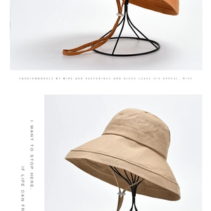 Close-up of wide brim sun hats with natural texture and adjustable windproof straps