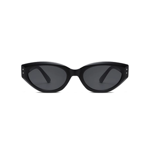 Vintage cat eye sunglasses with black frames and silver rivets on a white background
