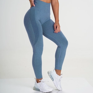 Detail view of high-waisted seamless knit yoga pants with a peach lift effect in misty blue