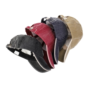 Assorted washed denim baseball caps with anchor embroidery shown in multiple colors