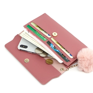 Elegant long wallet for women in dusty pink with card slots and a pompom charm