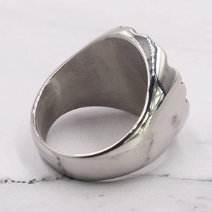 Close-up of men's stainless steel ring showing brushed inner finish and polished edge