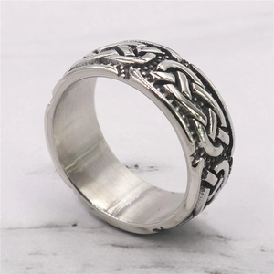 Vintage stainless steel Celtic knot ring with intricate woven patterns and black detailing