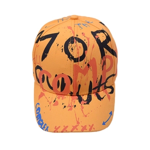 Kids orange baseball cap with street graffiti patterns and curved brim on white background