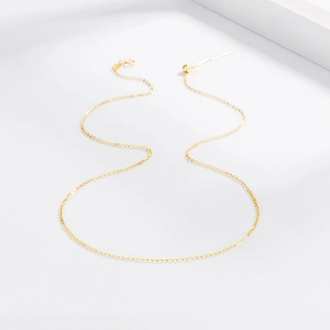 Detail of adjustable gold box chain with lobster clasp and needle pin for pearls