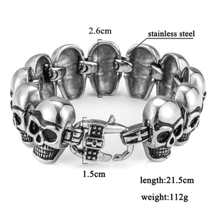 Detail view of punk stainless steel skull bracelet with dimensions 21.5cm length and 2.6cm width