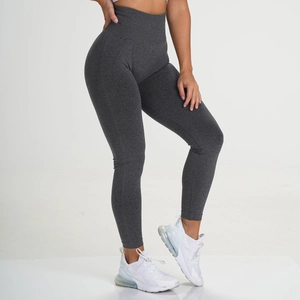 Detail of high-waisted dark grey seamless leggings with breathable knitted fabric texture