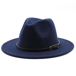 Close-up of dark blue wool fedora hat with black leather band and silver metal buckle