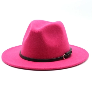 Detail of fuchsia wool fedora hat with a black leather band and silver metal buckle