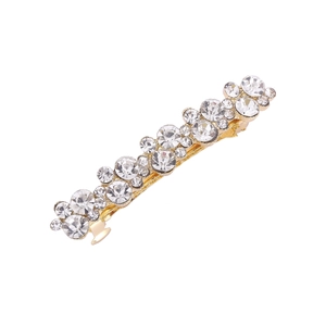 Elegant gold metal hair clip with sparkling wavy rhinestones on a white background