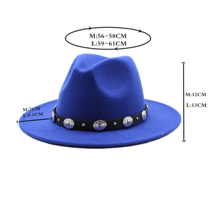 Detailed view of royal blue fedora hat sizing with leather band and metal studs decor
