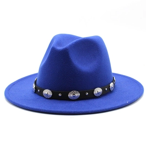 Detail of royal blue wool fedora featuring black leather band and ethnic metal studs