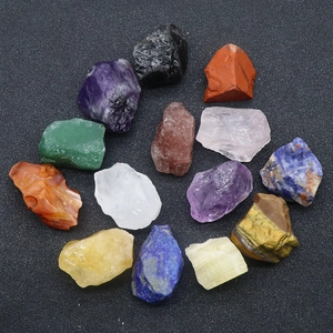 Collection of 14 raw natural crystal stones and minerals arranged in a circular layout