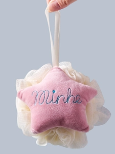 Star-shaped bath puff with pink plush star and white mesh loofah on a hanging rope