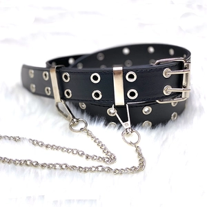 Black punk style belt with silver double chains and dual-prong metal buckle on white faux fur