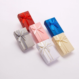 Mini rectangular jewelry gift boxes with bow ribbons in red, pink, blue and white colors