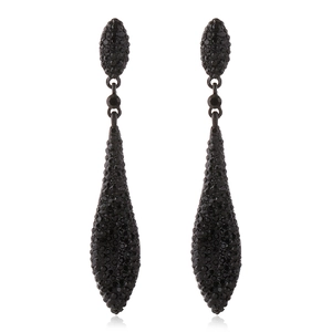 Detailed view of luxury black teardrop earrings with pavé crystals on a white background